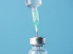 front-view-vaccination-elements-composition-close-up_23-2148613981