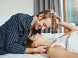 happy-couple-lying-bed-smiling-looking-each-other-with-love-passion-eyes-boyfriend-gives-his-lover-kiss-asks-if-she-wants-coffee-while-breakfast-is-ready_176420-8728