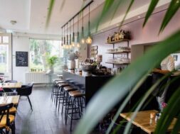 interior-shot-cafe-with-chairs-near-bar-with-wooden-tables_181624-1669