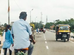 man-riding-bicycle-people-walking-road-with-cars-running-near-mahabodhi-temple-bodh-gaya-bihar-india_43263-2192