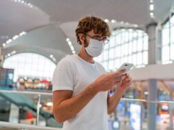 man-wearing-face-protective-medical-mask-using-smartphone_273443-3754