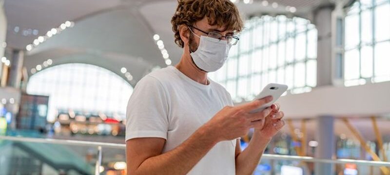 man-wearing-face-protective-medical-mask-using-smartphone_273443-3754