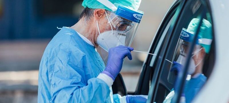 medical-personnel-wearing-ppe-performing-pcr-with-swab-their-hand-patient-inside-his-car-detect-if-he-is-infected-with-covid-19_325364-220