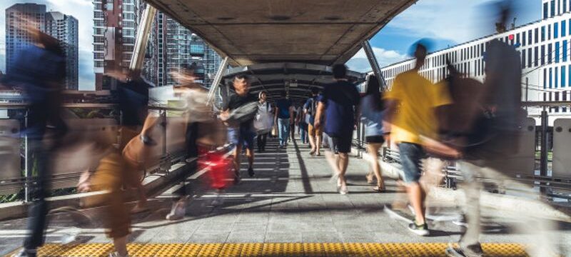 motion-blur-crowded-asian-people-walking-elevated-public-walkway_43552-35