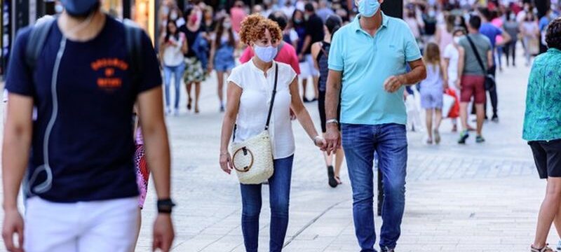 people-walk-comercial-street-named-meritxell-after-covid19_181624-28812