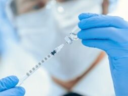 scientist-filling-syringe-with-new-vaccine_160672-5886