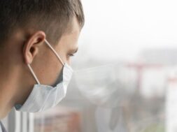 side-view-man-with-medical-mask-looking-through-window_23-2148815256