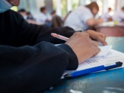 students-wearing-mask-protect-covid-19-doing-exam-classroom-with-stress_73622-1794
