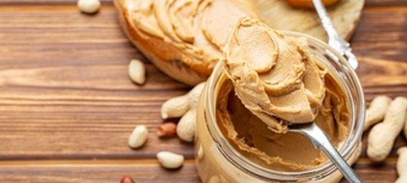 toast-sandwich-with-peanut-butter-spoon-jar-peanut-butter-peanuts-cooking-breakfast_221542-627