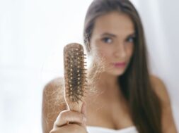 Hair Loss. Upset Woman Holding Brush With Hair
