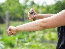 young-woman-spraying-mosquito-insect-repellent-forrest_310913-327
