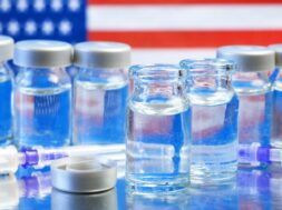 american-flag-syringes-with-coronavirus-vaccine-table_255485-630