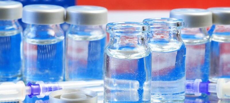 american-flag-syringes-with-coronavirus-vaccine-table_255485-630
