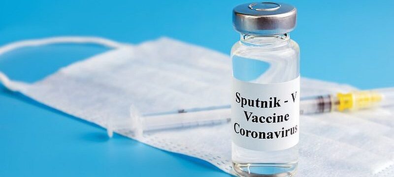 ampoule-with-vaccine-against-virus-with-medical-mask-insulin-syringe_262398-438