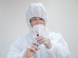 asian-male-doctor-medical-ppe-holding-syringe-injecting-blood-sample-laboratory_49071-3211