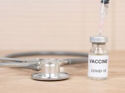 coronavirus-covid-19-vaccine-vial-put-doctor-s-desk_43157-1375
