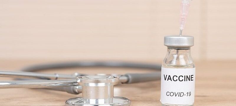 coronavirus-covid-19-vaccine-vial-put-doctor-s-desk_43157-1375