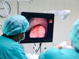 doctor-performing-colonoscopy-operating-room_12892-31