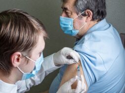 elderly-man-caucasian-appearance-mask-receives-dose-coronavirus-vaccination-home_308589-1588