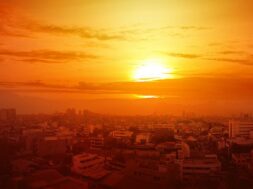 heatwave-city-with-glowing-sun-background_9083-3787
