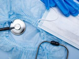 medical-protection-mask-blue-gloves-blue-background-disposable-cap-stethoscope-top-view_373520-648