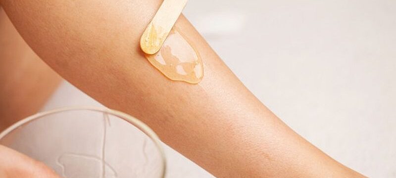 skin-care-woman-applies-wax-her-leg-remove-hair_118454-11928
