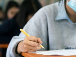 students-wearing-mask-protect-coronavirus-doing-exam-classroom-with-stress_73622-2032
