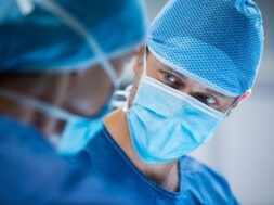 surgeons-interacting-while-performing-operation_1170-2225