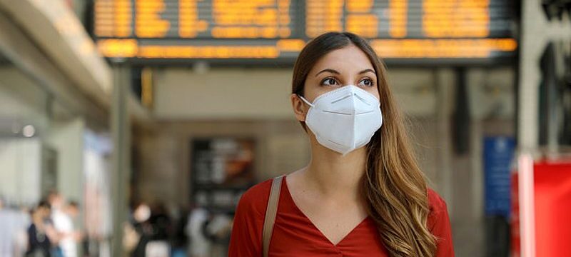 traveler-woman-wearing-kn95-ffp2-face-mask-train-station-protect-from-virus-smog_63239-71