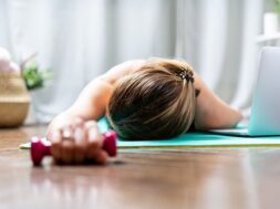 woman-lying-floor-resting-after-training-home_339191-1