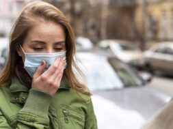 woman-wearing-mask-holding-her-hand-her-face_23-2148480535