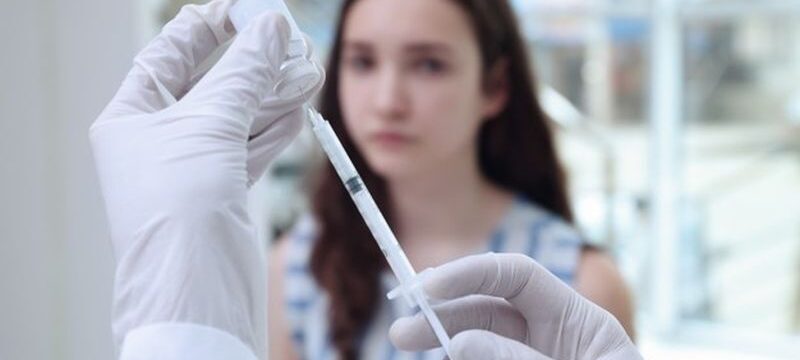 young-girl-receiving-vaccination-hospital_392895-18857