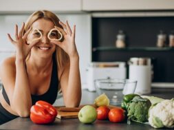 young-sporty-woman-with-pepper-kitchen_1303-24754
