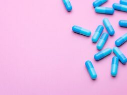 blue-capsule-pills-pink-background-with-copy-space_33867-1782