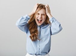 cannot-handle-pressure-anymore-tensed-fed-up-european-female-model-blue-collar-shirt-yelling-screaming-while-holding-hands-head-with-closed-eyes-feeling-pain-suffering-depression_176420-25051