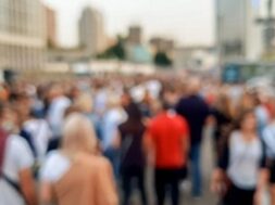 defocused-image-big-crowd-people-celebrating-carnaval-holidays-city-street_454047-7588