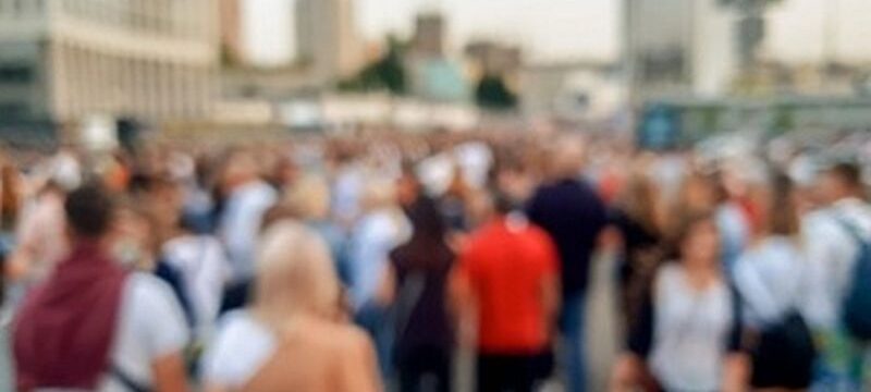 defocused-image-big-crowd-people-celebrating-carnaval-holidays-city-street_454047-7588