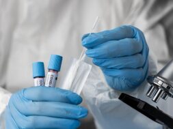 doctor-analyzing-blood-samples-with-microscope_23-2148958410