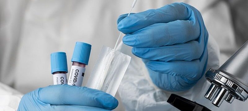 doctor-analyzing-blood-samples-with-microscope_23-2148958410