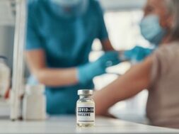 female-nurse-making-coronavirus-vaccination-mature-woman-while-working-hospital_425904-4419