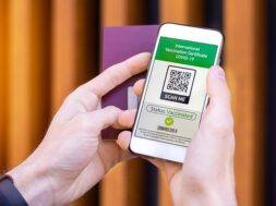 male-hand-holding-passport-smartphone-with-international-vaccination-certificate-covid-19-qr-code_1268-17833