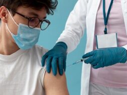 man-getting-vaccine-close-up_23-2148989384