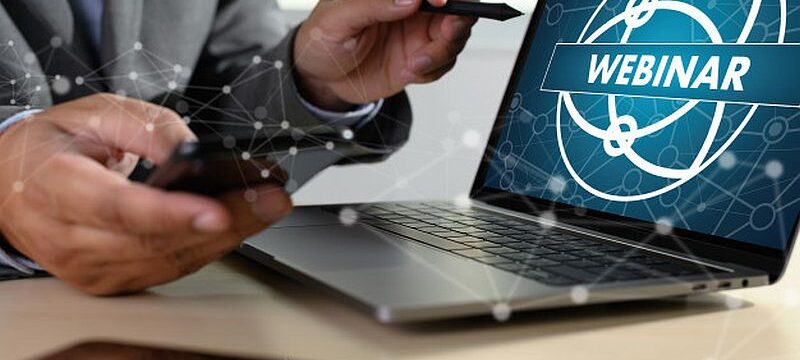 man-with-laptop-showing-webinar-screen_36325-2225