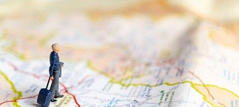 miniature-business-people-standing-map-travel-concept_29654-725