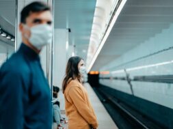 passengers-protective-masks-standing-metro-station_160672-9020