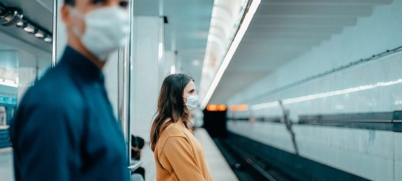passengers-protective-masks-standing-metro-station_160672-9020