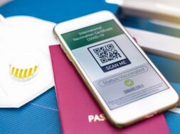 passport-smartphone-with-international-vaccination-certificate-covid-19-qr-code-suitcase-with-mask_1268-17840