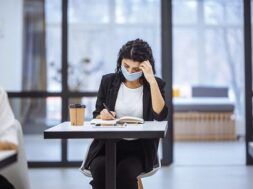 portrait-two-women-working-office-desks-wearing-medical-mask-staying-safe-during-covid-19-pandemic-outbreak_243724-662