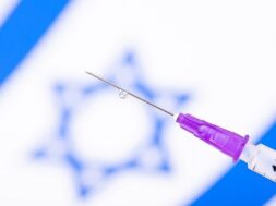 syringe-with-vaccine-front-israel-flag_123211-1873