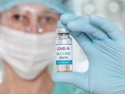 woman-doctor-holding-vial-with-coronavirus-vaccine-covid-delta-variant_85601-942